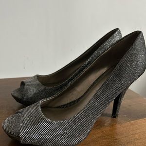 Fergalicious by Fergie peep toe pumps in silver. Size 6.5.